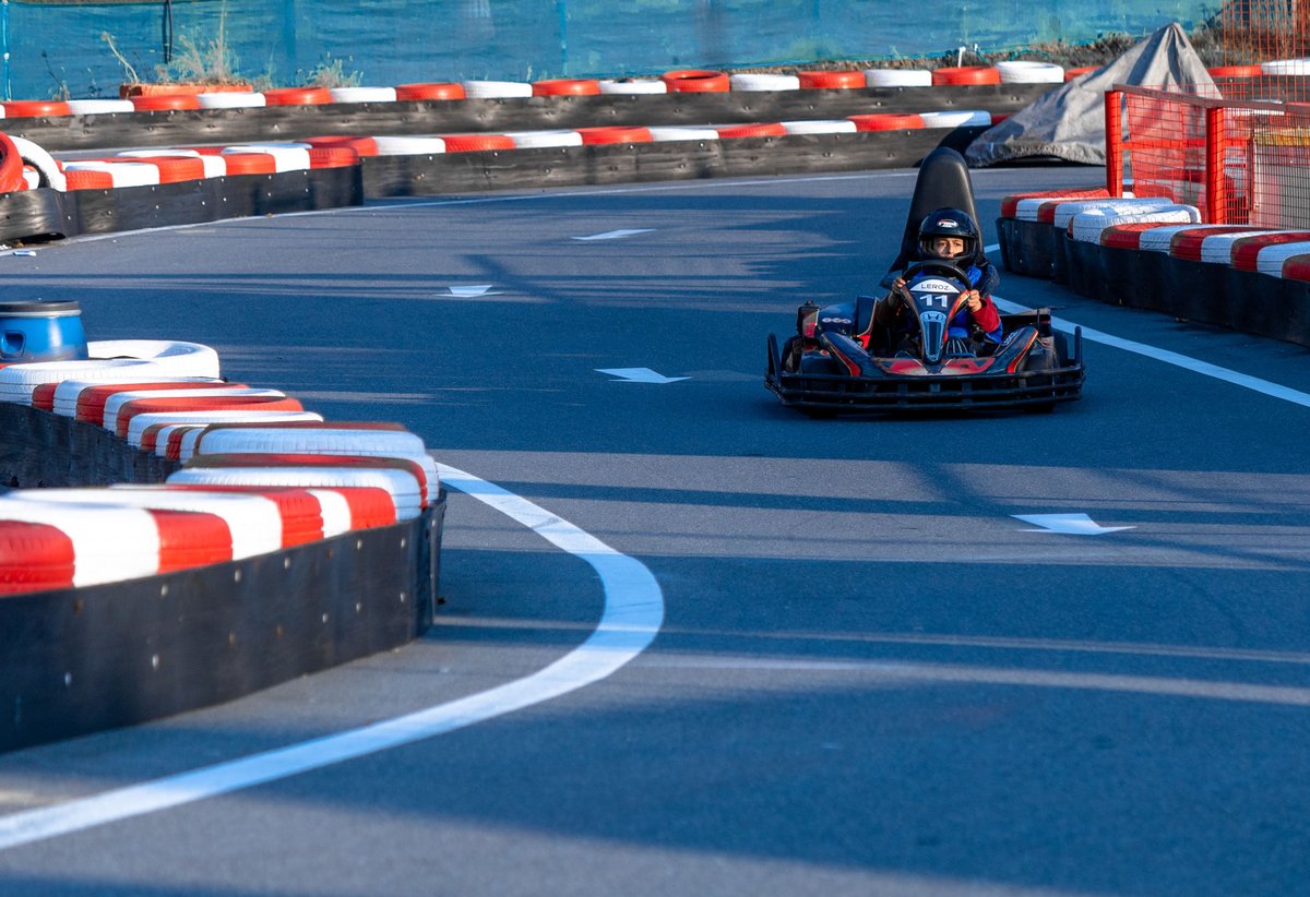 A go-kart navigating a track turn — small, fast, focused trials before the full race