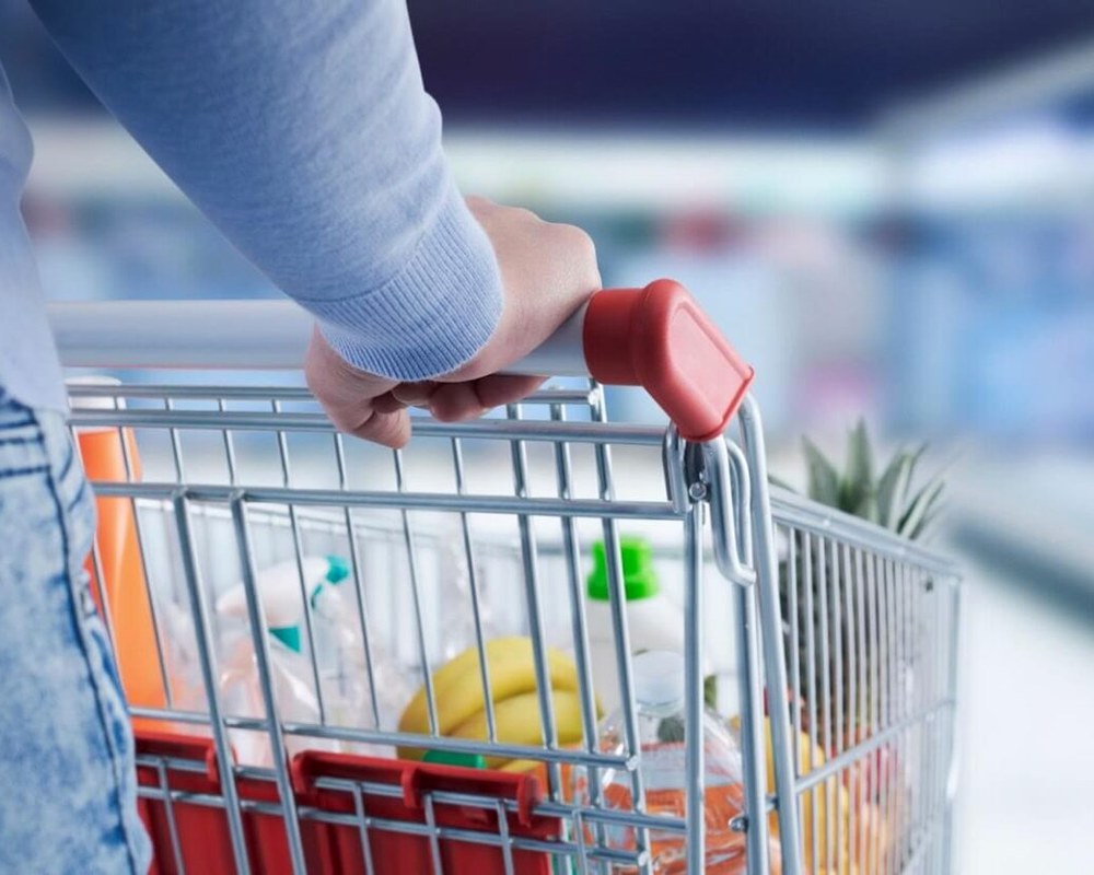 A shopper with a full cart — AI personalising one customer across every channel