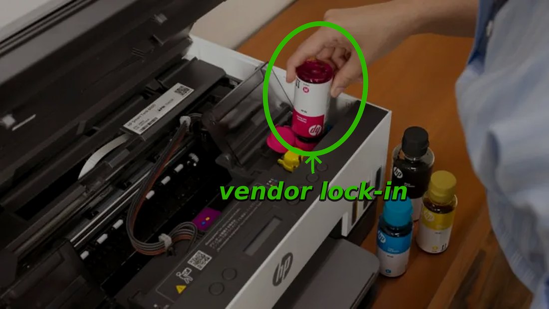 A hand refilling printer ink from a bottle instead of buying a locked proprietary cartridge — a metaphor for avoiding vendor lock-in